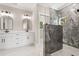 Elegant bathroom featuring double sinks and a sleek glass-enclosed shower at 209 Bouquets Green Way, Myrtle Beach, SC 29579