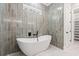 Modern bathroom with a freestanding tub and stylish tile work at 209 Bouquets Green Way, Myrtle Beach, SC 29579