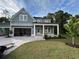 Charming two-story home with a covered porch, spacious garage, and newly installed lawn at 209 Bouquets Green Way, Myrtle Beach, SC 29579