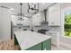 Modern kitchen featuring white cabinets, stainless steel appliances, and a large island at 209 Bouquets Green Way, Myrtle Beach, SC 29579