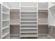 Walk-in closet featuring custom shelving and ample storage space at 209 Bouquets Green Way, Myrtle Beach, SC 29579