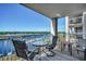 The spacious balcony features a table and chairs and beautiful views of the water at 2151 Bridge View Ct. # 2-803, North Myrtle Beach, SC 29582
