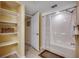 Bathroom featuring a shower/tub combo with a decorative shower curtain and open shelving at 2151 Bridge View Ct. # 2-803, North Myrtle Beach, SC 29582