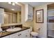 A well-lit bathroom features a vanity and built-in shelving at 2151 Bridge View Ct. # 2-803, North Myrtle Beach, SC 29582
