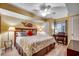 Bright bedroom with light yellow walls, a work desk and a ceiling fan to keep you cool at 2151 Bridge View Ct. # 2-803, North Myrtle Beach, SC 29582