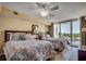 Bright bedroom with two beds, ceiling fan, and access to a balcony with a water view at 2151 Bridge View Ct. # 2-803, North Myrtle Beach, SC 29582