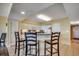 Open kitchen with a breakfast bar, pendant lighting, white cabinets, and seamless flow into the dining and living spaces at 2151 Bridge View Ct. # 2-803, North Myrtle Beach, SC 29582
