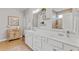 Bathroom with dual sinks, white cabinets and great lighting fixtures at 2446 Craven Dr., Myrtle Beach, SC 29572