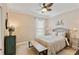 Cozy bedroom featuring a patterned bedspread, a decorative bicycle, and a rustic, green dresser at 2446 Craven Dr., Myrtle Beach, SC 29572