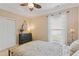 Charming bedroom featuring a patterned bedspread, a rustic dresser, and a window at 2446 Craven Dr., Myrtle Beach, SC 29572