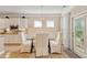 Well-lit dining area featuring a glass table, wainscoting and direct access to the outside at 2446 Craven Dr., Myrtle Beach, SC 29572