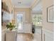 Inviting foyer with a decorative glass front door, decorative wall trim, and a glimpse into the living spaces at 2446 Craven Dr., Myrtle Beach, SC 29572