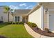 Well-maintained home featuring a landscaped front yard, walkway, and palm tree for a welcoming curb appeal at 2446 Craven Dr., Myrtle Beach, SC 29572