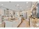 Stylish kitchen with a granite island, stainless steel appliances, and ample cabinet space, plus modern pendant lighting at 2446 Craven Dr., Myrtle Beach, SC 29572