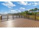 Scenic view from the deck overlooking the tranquil lake and lush surrounding trees at 2446 Craven Dr., Myrtle Beach, SC 29572