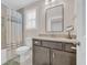 Bright bathroom featuring a vanity with granite countertop and framed mirror at 25 Northwoods Ct., Pawleys Island, SC 29585