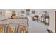 Shared bedroom featuring two twin beds with colorful quilted bedspreads and comfortable sitting area at 25 Northwoods Ct., Pawleys Island, SC 29585