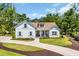 Charming home with a well manicured lawn and a circular driveway at 25 Northwoods Ct., Pawleys Island, SC 29585