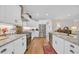 Bright, functional kitchen showcasing stainless steel appliances, granite countertops and white cabinetry at 25 Northwoods Ct., Pawleys Island, SC 29585