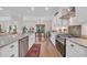 Open kitchen with granite countertops, stainless steel appliances, and seamless flow into the dining area at 25 Northwoods Ct., Pawleys Island, SC 29585