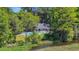 Community pool area featuring lounge chairs and a view of the lake at 25 Northwoods Ct., Pawleys Island, SC 29585