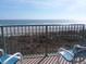 Relaxing ocean view from the balcony with comfortable seating and a metal railing at 2507 S Ocean Blvd. S, North Myrtle Beach, SC 29582