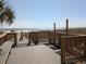 Wooden deck and walkway leading to the beach, with outdoor showers available at 2507 S Ocean Blvd. S, North Myrtle Beach, SC 29582
