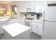 Well-equipped kitchen features white cabinets, stainless steel appliances and an island at 2507 S Ocean Blvd. S, North Myrtle Beach, SC 29582