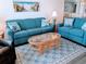 Cozy living room features comfortable seating and a decorative glass top coffee table at 2507 S Ocean Blvd. S, North Myrtle Beach, SC 29582