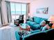 Bright living room with scenic views, comfortable sofas and stylish coastal decor at 2507 S Ocean Blvd. S, North Myrtle Beach, SC 29582