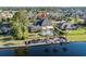 Expansive waterfront property featuring a pool, private dock, manicured lawn, and scenic lake views at 256 Shoreward Dr., Myrtle Beach, SC 29579