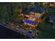 Aerial view of a luxury home with pool, outdoor kitchen, and private dock on the waterfront at 256 Shoreward Dr., Myrtle Beach, SC 29579