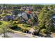 Scenic aerial shot of a lakefront home with palm trees, lush landscaping, and a circular driveway at 256 Shoreward Dr., Myrtle Beach, SC 29579