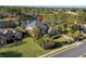 Aerial view of a waterfront home with lush landscaping, a lake, and a well-maintained lawn at 256 Shoreward Dr., Myrtle Beach, SC 29579