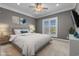 Comfortable bedroom features light grey walls, window with plantation shutters, and decorative art at 256 Shoreward Dr., Myrtle Beach, SC 29579