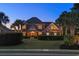 Elegant brick home with mature landscaping, manicured lawn, and inviting double door entrance at 256 Shoreward Dr., Myrtle Beach, SC 29579