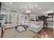Bright open living space featuring a plush sectional sofa, wood floors and shutters for lots of natural light at 256 Shoreward Dr., Myrtle Beach, SC 29579