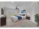 Calm main bedroom with neutral palette and bright window and ceiling fan for a relaxing retreat at 256 Shoreward Dr., Myrtle Beach, SC 29579