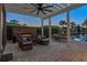 Outdoor living space with a stone fireplace, comfortable seating, and a pergola at 256 Shoreward Dr., Myrtle Beach, SC 29579