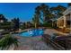 Relaxing pool area with lounge chairs and hot tub, perfect for enjoying the outdoors at 256 Shoreward Dr., Myrtle Beach, SC 29579