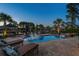Inviting pool area with lounge chairs and lush landscaping overlooking the serene waterfront at 256 Shoreward Dr., Myrtle Beach, SC 29579
