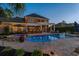 Beautiful pool area with outdoor kitchen, hot tub, and ample patio space perfect for entertaining at 256 Shoreward Dr., Myrtle Beach, SC 29579