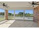 Screened porch offers serene waterfront views with brick columns and tiled floors at 256 Shoreward Dr., Myrtle Beach, SC 29579