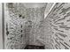 Walk-in shower boasts mosaic tile surround, multiple shower heads and integrated bench seating at 256 Shoreward Dr., Myrtle Beach, SC 29579