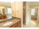 Bathroom with stone vanity and a tiled walk-in shower at 2600 Henagan Ln., Myrtle Beach, SC 29588