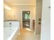 Bathroom with a tub, tiled shower, and an open doorway leading into another room at 2600 Henagan Ln., Myrtle Beach, SC 29588