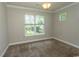 Cozy bedroom with neutral walls, carpet, and a window providing natural light at 2600 Henagan Ln., Myrtle Beach, SC 29588