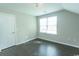 Well lit empty bedroom with a door and a large window for ample light at 2600 Henagan Ln., Myrtle Beach, SC 29588