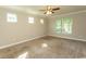 Large bedroom with plush carpet flooring and large windows at 2600 Henagan Ln., Myrtle Beach, SC 29588