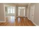 Inviting entryway with hardwood floors, transom window above the front door, and lots of natural light at 2600 Henagan Ln., Myrtle Beach, SC 29588